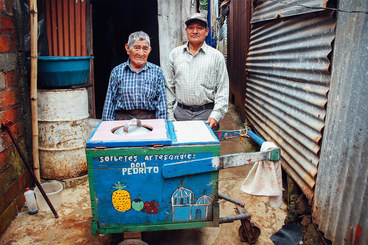 Pedro, left, was a sponsored elder. He passed away in 2020. For more than 50 years, he made and sold artisanal sorbet from a cart on the streets of Ataco, El Salvador.
